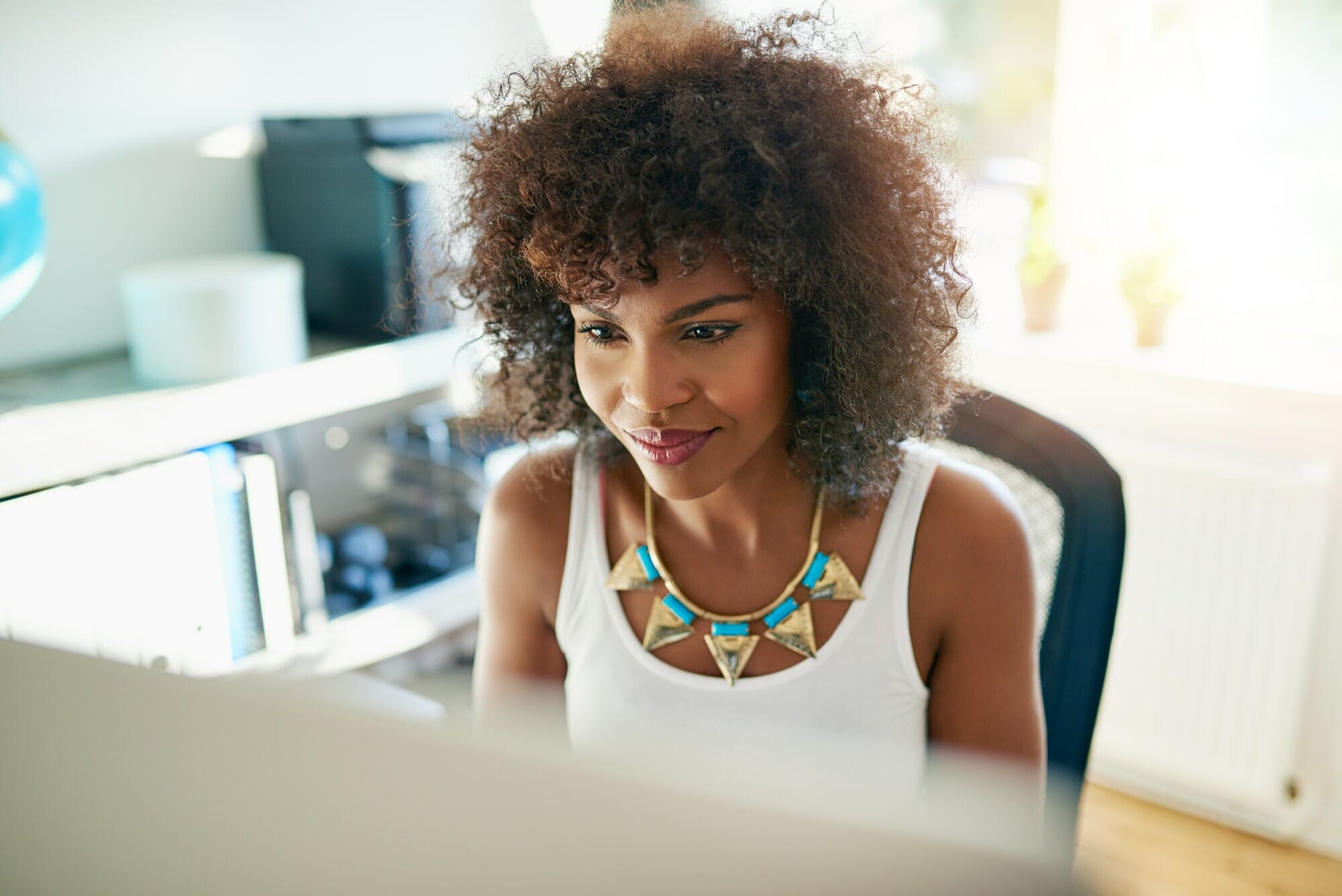 Attractive young woman working on a computer