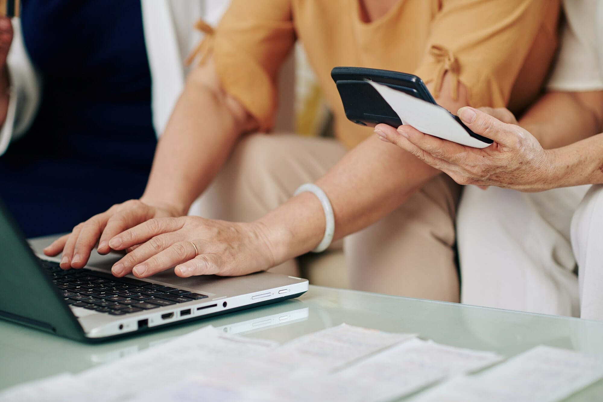 Senior women paying bills online